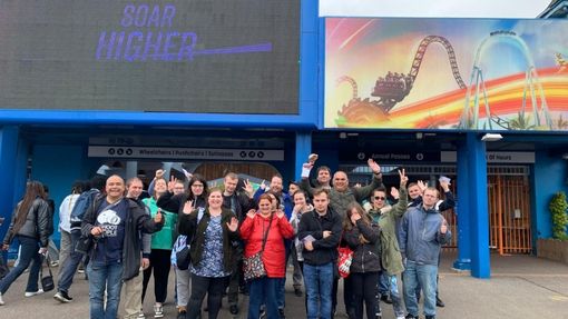 Picture of group of people on trip to theme park